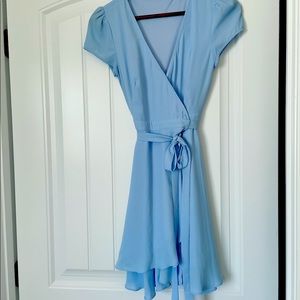 Adorable Boutique Wrap dress. Fit and flare mini dress size Small. Wrap tie